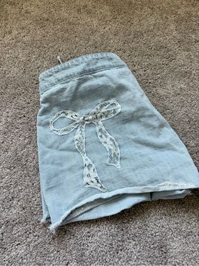 Light Wash Denim Wrap Skort with Lace Bow Detail